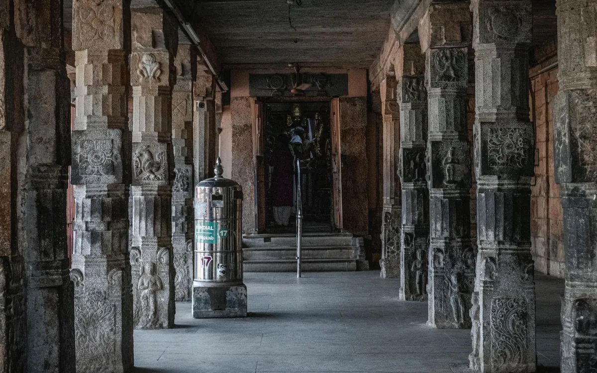 A long stone corridor inside an ancient Hindu temple