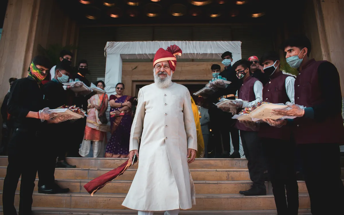 Guests celebrating during a baraat procession at an Indian wedding