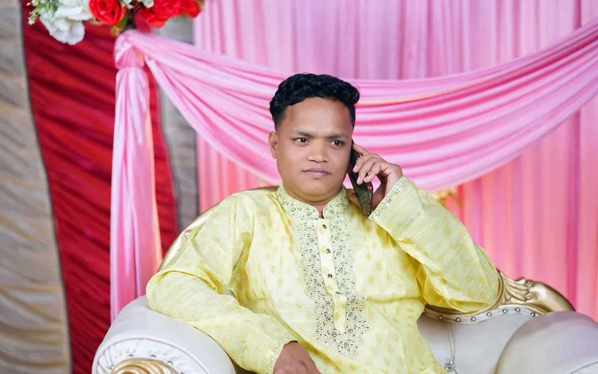 An Indian man in a kurta on a phone call with a prospective match