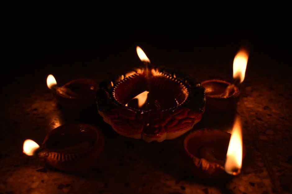 Oil lamps lit during a festival, a familiar sight in Goswami family homes