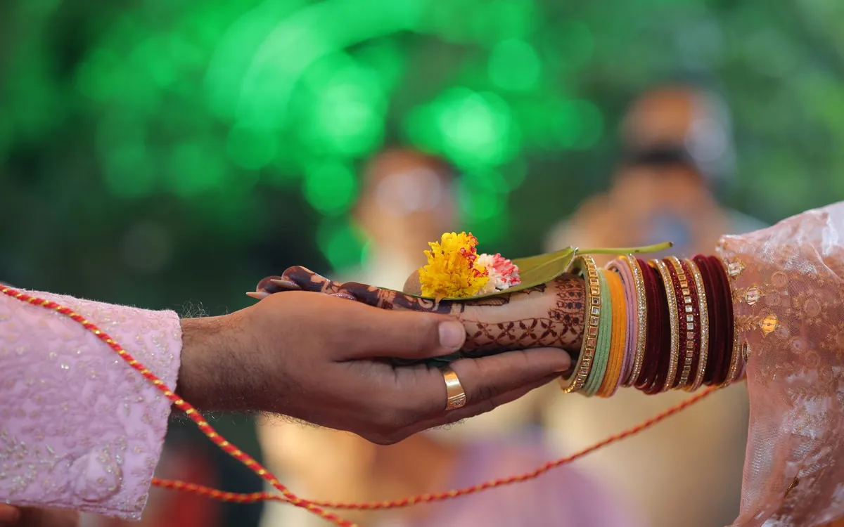 Parents giving their daughter's hand
