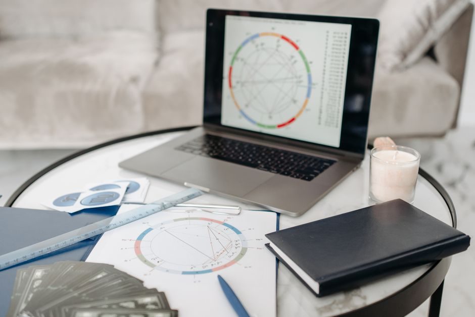 An astrologer's desk with charts, where kundli matching is carried out
