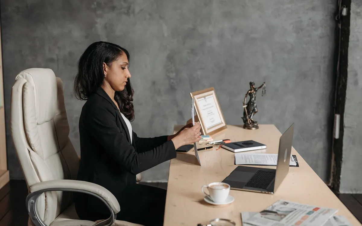 An Indian family meeting a consultant across an office desk