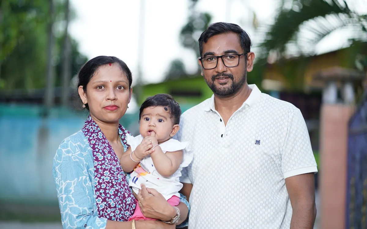 Indian parents looking through photos together at home