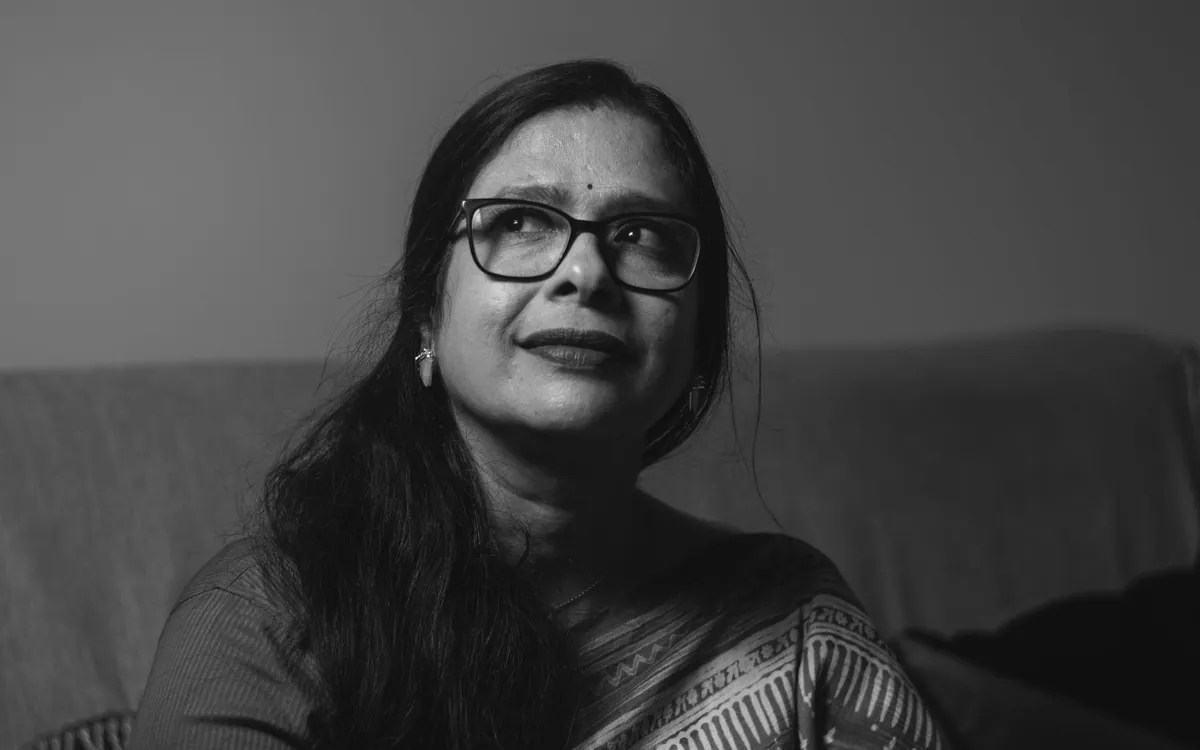 A woman counsellor in glasses, photographed in black and white