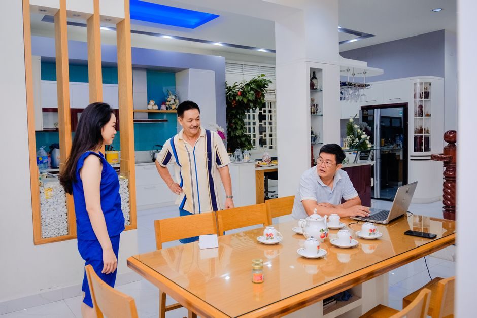 Two families meeting over tea to discuss a marriage proposal