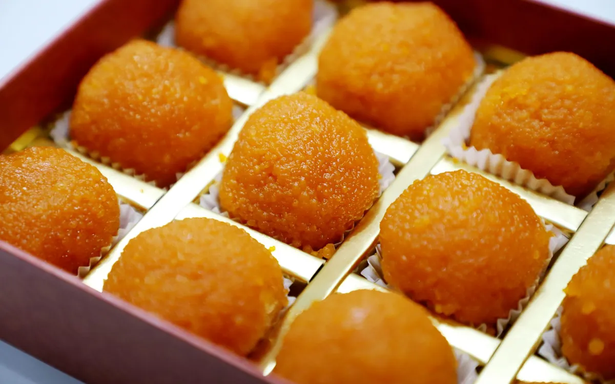 A box of orange laddoos